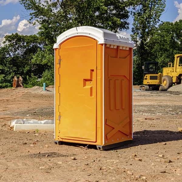 what is the cost difference between standard and deluxe portable toilet rentals in Dickinson County KS